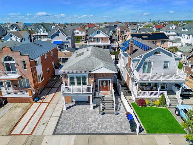 161 Bch 129th St, Rockaway Park, NY 11694 - view of front of house with a residential view, brick siding, and roof with shingles