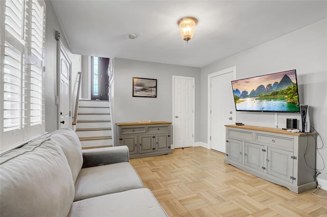161 Bch 129th St, Rockaway Park, NY 11694 - living room featuring stairs, healthy amount of natural light, and baseboards