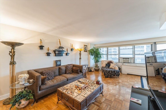 living room featuring a healthy amount of sunlight and cooling unit