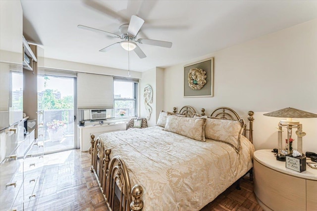 bedroom featuring access to outside, a ceiling fan, and cooling unit