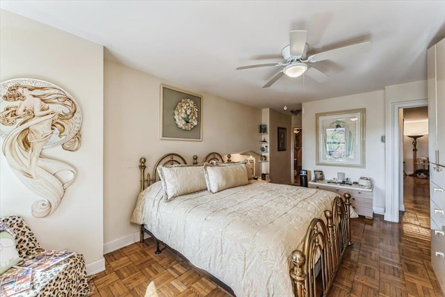 bedroom featuring baseboards and ceiling fan