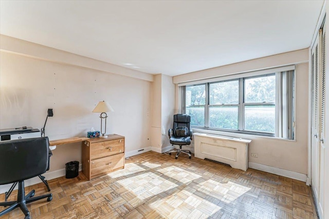 office space with baseboards