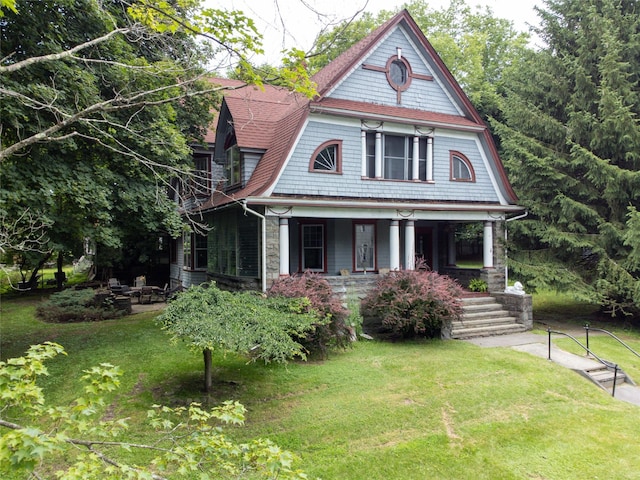 12 Highview Ave, Callicoon, NY 12723 - victorian house featuring a front lawn and covered porch