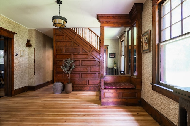 12 Highview Ave, Callicoon, NY 12723 - corridor with wood finished floors, wallpapered walls, and stairs