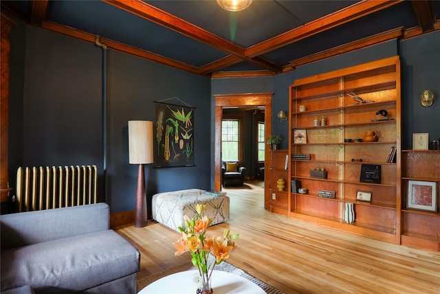 12 Highview Ave, Callicoon, NY 12723 - living room featuring radiator, wood finished floors, beamed ceiling, and coffered ceiling