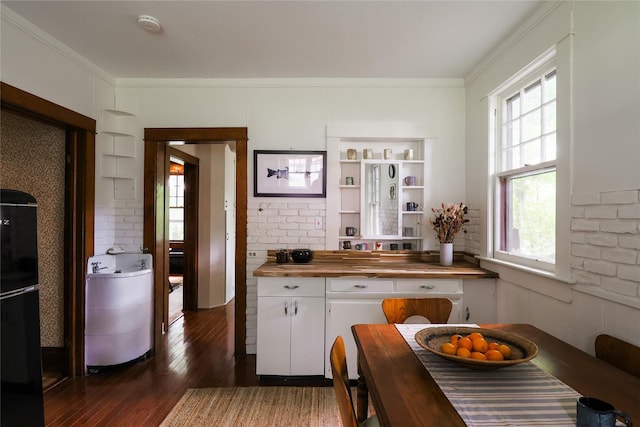 12 Highview Ave, Callicoon, NY 12723 - kitchen with butcher block counters, hardwood / wood-style flooring, white cabinets, freestanding refrigerator, and crown molding