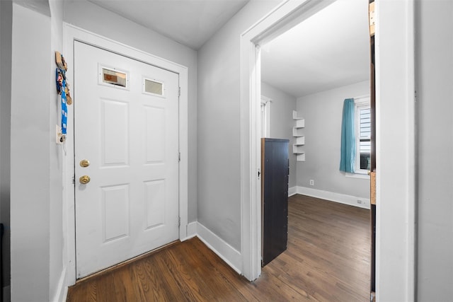 entrance foyer with baseboards and dark wood finished floors