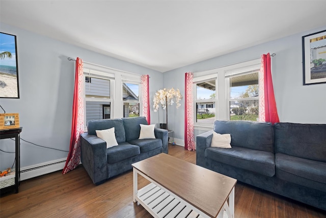 living room with a baseboard radiator and wood finished floors