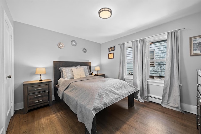bedroom featuring baseboards, a baseboard radiator, and dark wood-type flooring