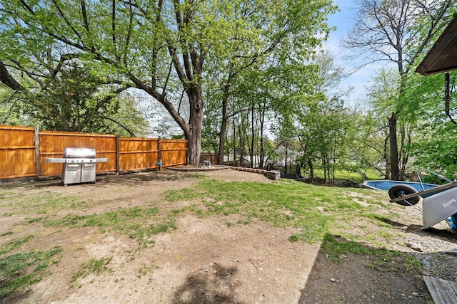view of yard with a fenced backyard