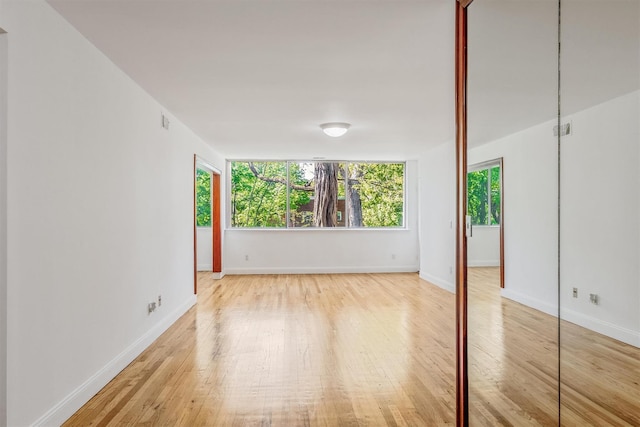 523 Colony Dr, Hartsdale, NY 10530 - empty room with visible vents, wood finished floors, and baseboards