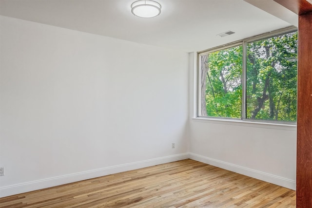 523 Colony Dr, Hartsdale, NY 10530 - unfurnished room with light wood finished floors, visible vents, and baseboards