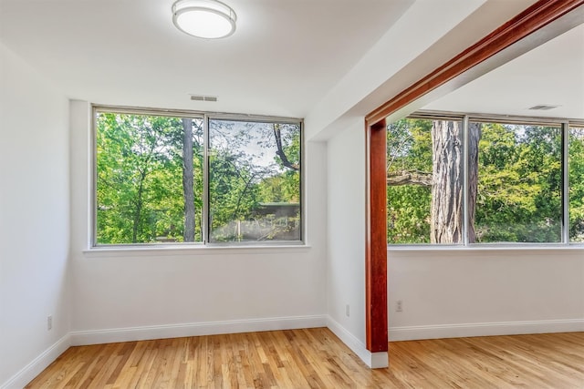 523 Colony Dr, Hartsdale, NY 10530 - unfurnished room with a wealth of natural light, visible vents, and light wood-type flooring