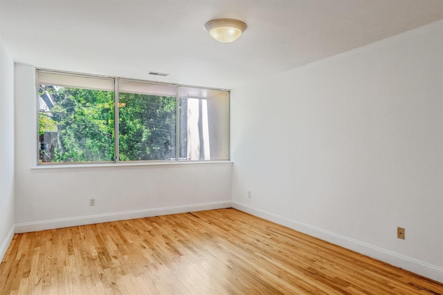 523 Colony Dr, Hartsdale, NY 10530 - unfurnished room with baseboards, a wealth of natural light, light wood finished floors, and visible vents
