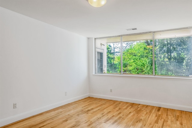 523 Colony Dr, Hartsdale, NY 10530 - empty room with baseboards, a healthy amount of sunlight, light wood-style flooring, and visible vents