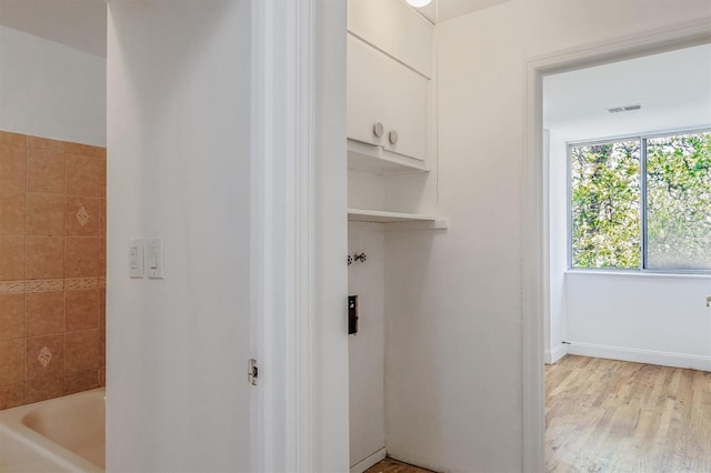 523 Colony Dr, Hartsdale, NY 10530 - corridor with light wood finished floors, visible vents, and baseboards
