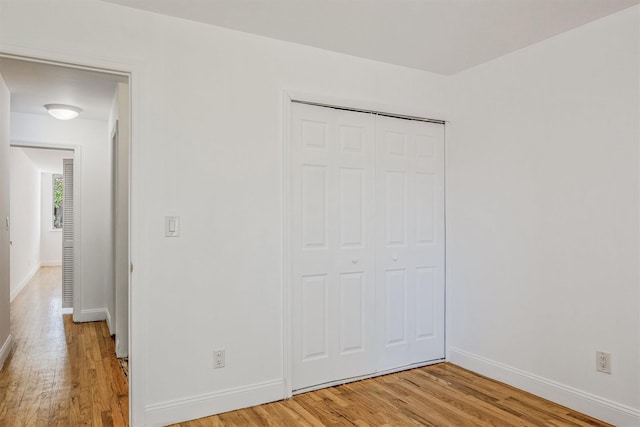 523 Colony Dr, Hartsdale, NY 10530 - unfurnished bedroom featuring a closet, light wood-type flooring, and baseboards