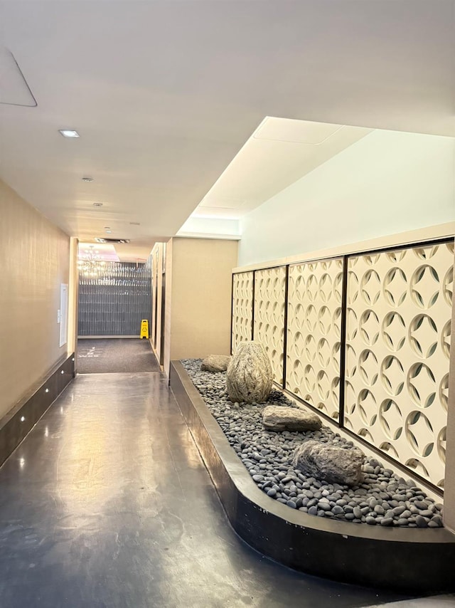 hall with finished concrete floors