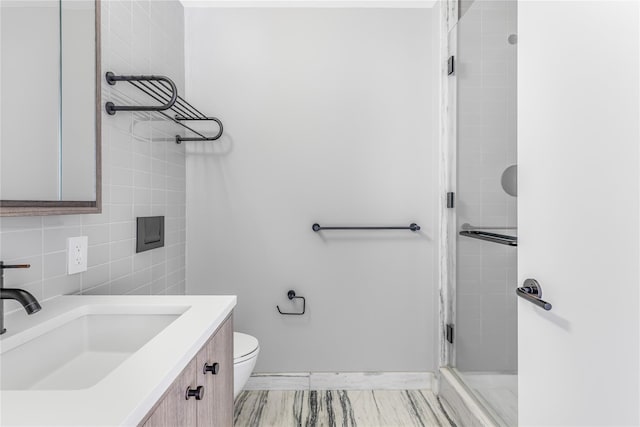 175 W 95th St Unit 27G, New York Manhattan, NY 10025 - full bath featuring a shower stall, baseboards, vanity, and toilet
