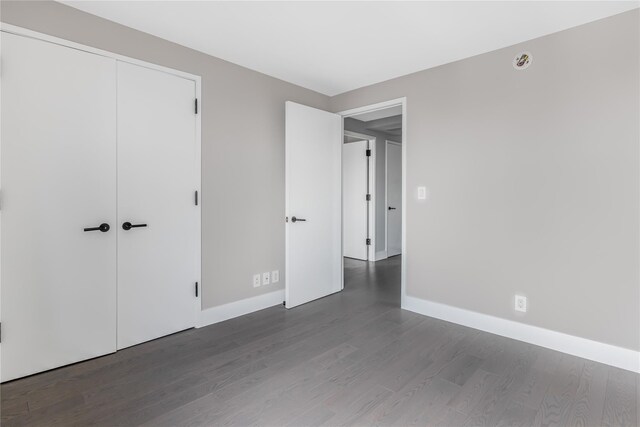 175 W 95th St Unit 27G, New York Manhattan, NY 10025 - unfurnished bedroom with baseboards, a closet, and wood finished floors