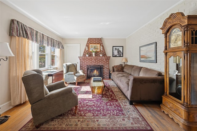 219 Third Ave, Pelham, NY 10803 - living room with ornamental molding, a fireplace, wood finished floors, brick wall, and baseboards