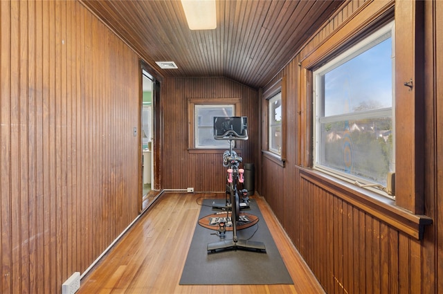 219 Third Ave, Pelham, NY 10803 - exercise area with light wood-type flooring, wooden walls, wood ceiling, and vaulted ceiling