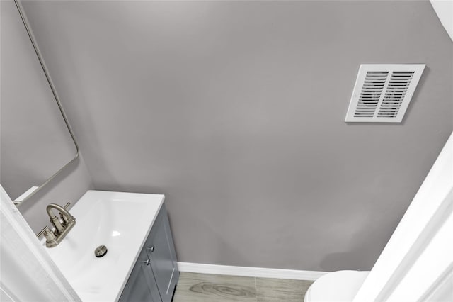 62-22 80th Rd, Glendale, NY 11385 - half bathroom with baseboards, vanity, and toilet