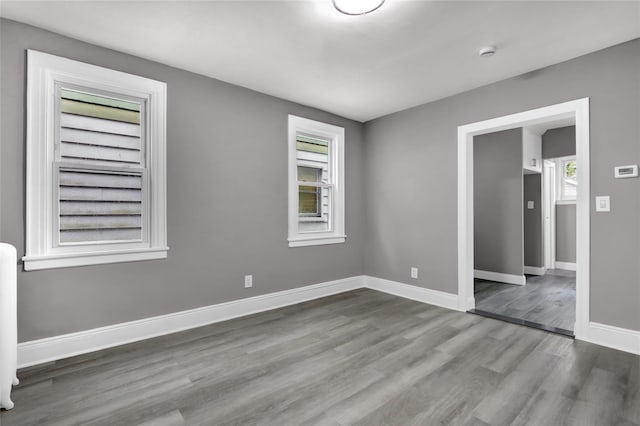62-22 80th Rd, Glendale, NY 11385 - spare room featuring wood finished floors and baseboards