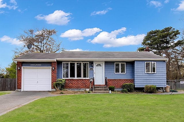 ranch-style house with a front yard, brick siding, fence, aphalt driveway, and an attached garage