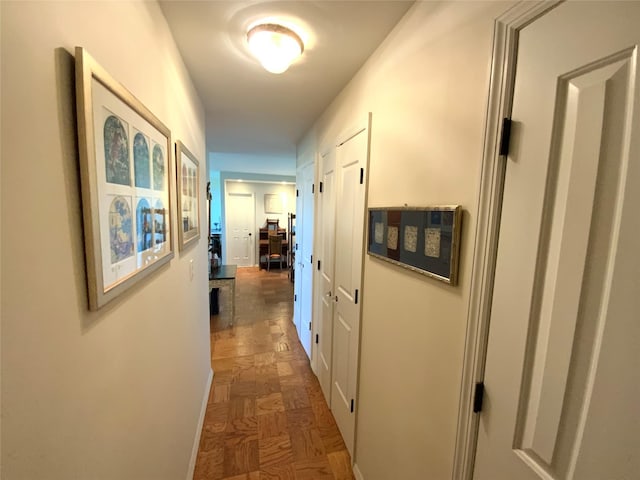 corridor featuring baseboards