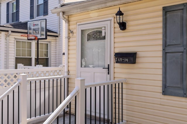 view of exterior entry featuring a porch