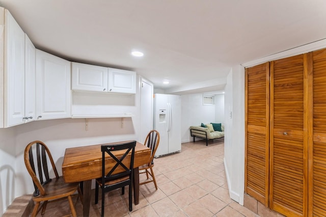 dining area featuring recessed lighting, baseboards, and light tile patterned floors