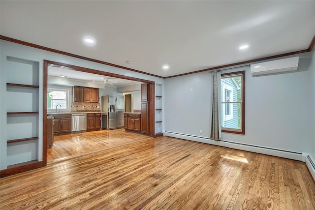 unfurnished living room with crown molding, a ceiling fan, light wood-style flooring, and an AC wall unit