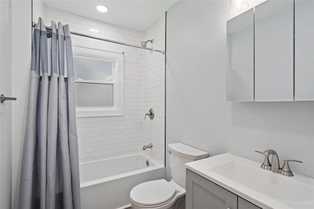 full bathroom featuring toilet, shower / bathtub combination with curtain, and vanity