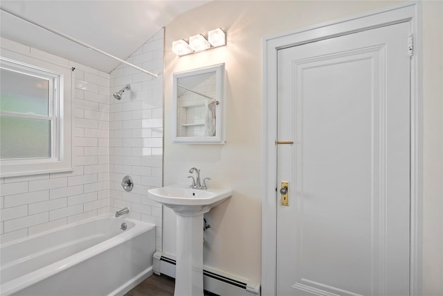 bathroom with  shower combination, baseboard heating, and lofted ceiling