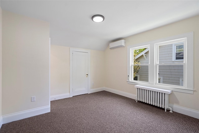 carpeted spare room with baseboards, a wall mounted air conditioner, radiator, and lofted ceiling