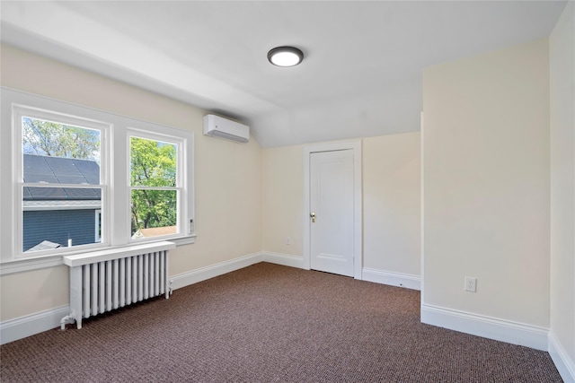 empty room featuring vaulted ceiling, baseboards, an AC wall unit, radiator, and dark carpet