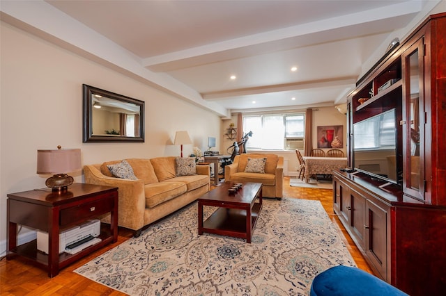 living area featuring beam ceiling and recessed lighting