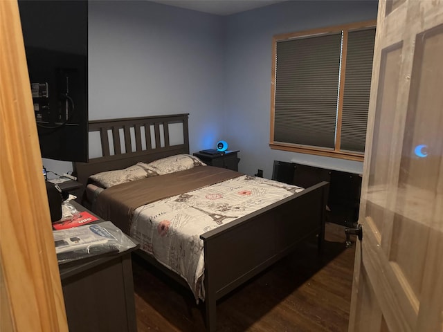 bedroom featuring dark wood-type flooring
