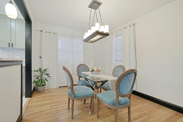 26 Hoke Dr, Stony Point, NY 10980 - dining room with light wood-style floors, a chandelier, and ornamental molding