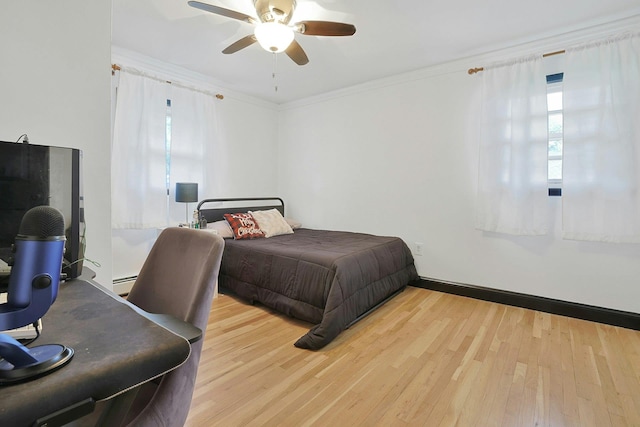 26 Hoke Dr, Stony Point, NY 10980 - bedroom with a ceiling fan, wood finished floors, baseboard heating, and ornamental molding