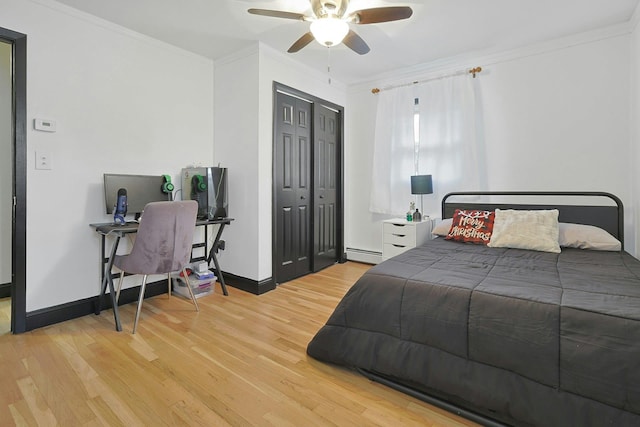 26 Hoke Dr, Stony Point, NY 10980 - bedroom with a baseboard radiator, a closet, baseboards, crown molding, and wood finished floors