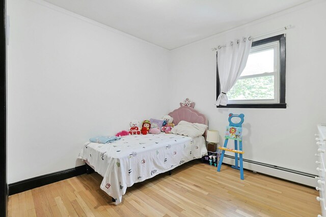 26 Hoke Dr, Stony Point, NY 10980 - bedroom with light wood-style flooring, baseboard heating, and ornamental molding