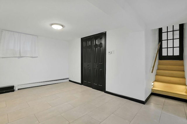 26 Hoke Dr, Stony Point, NY 10980 - spare room with stairway, baseboards, and a baseboard heating unit