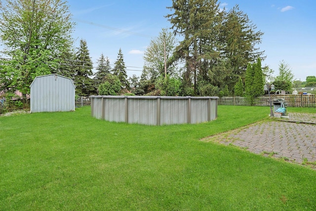 26 Hoke Dr, Stony Point, NY 10980 - view of yard with an outbuilding, fence, a storage unit, and a patio