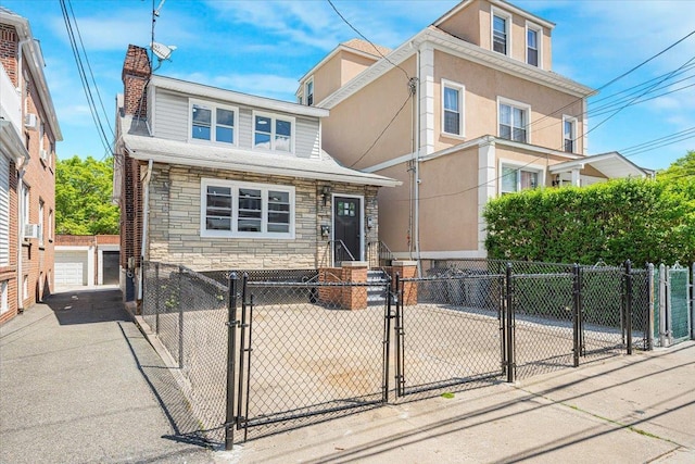 1704 Yates Ave, Bronx, NY 10461 - view of front of property with stone siding, a gate, a chimney, a fenced front yard, and a garage
