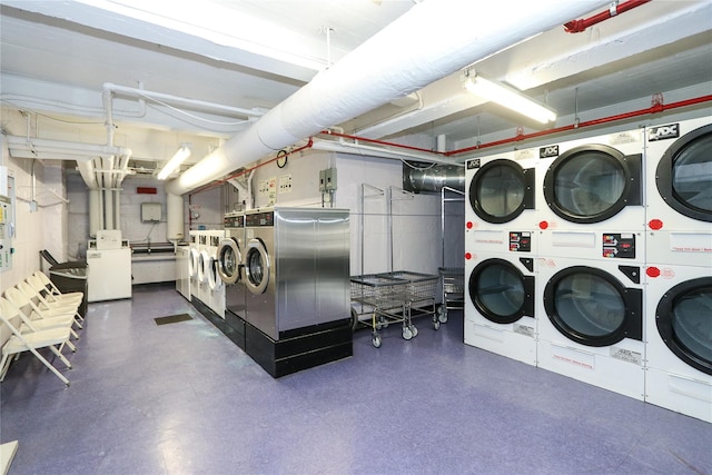 shared laundry area with stacked washer and clothes dryer and washer and dryer