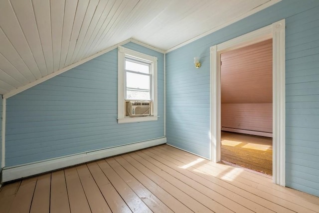 bonus room featuring lofted ceiling, a baseboard radiator, hardwood / wood-style flooring, and cooling unit