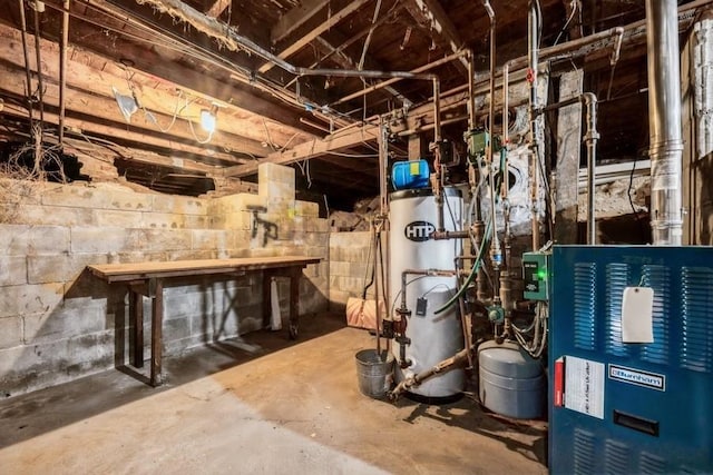 utility room with a heating unit and gas water heater