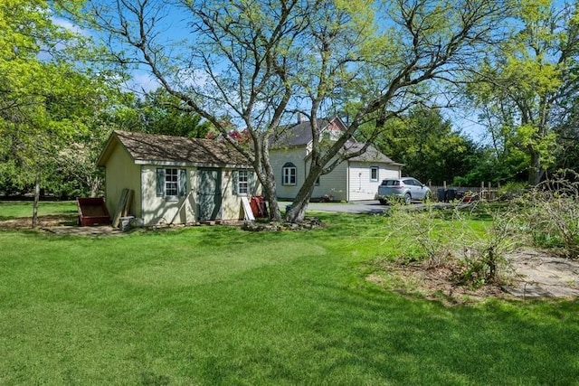 rear view of house featuring a lawn
